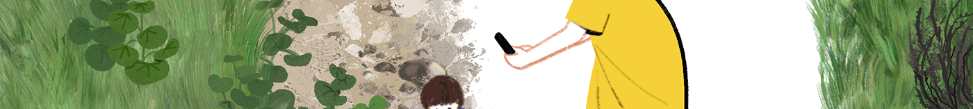 A mother takes a photo of a child sitting on a rock.